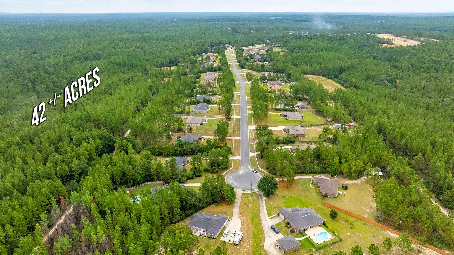 Aerial view of surrounding neighborhood