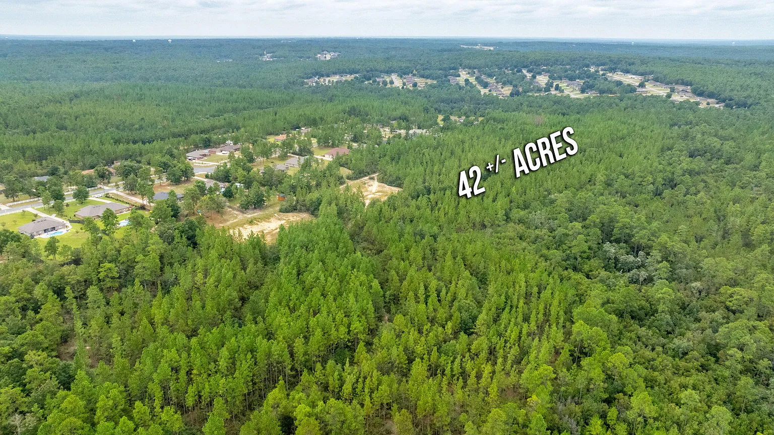 Aerial view of wooded acreage